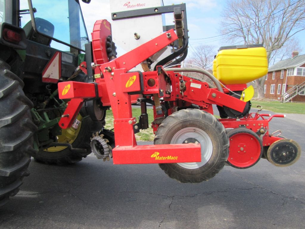 a row seeder attached to tractor