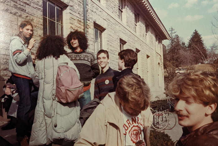 Members of the LGBT Coalition (1990s) gather on the steps of Goldwin Smith Hall to socialize. Photographer and date unknown.