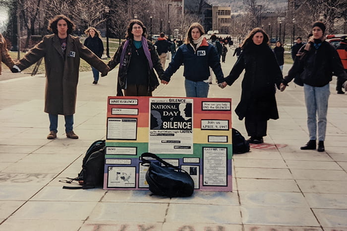 Queer students hold hands on Ho Plaza as they observe National Day of Silence, a day to remember queer individuals who have taken their lives because of homophobia. April 9, 1997. Credit: Photographer unknown