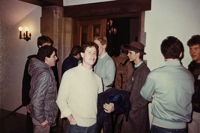 Members of the LGBT Coalition (1990s) gather inside Willard Straight Hall at the International Lounge for a club meeting.