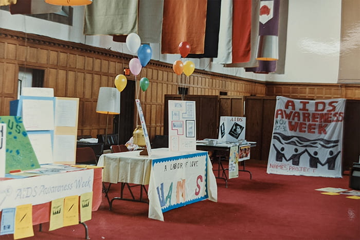 Another photo of the Biology and Society 451 AIDS Awareness Week, held in the ballroom in Willard Straight Hall. Posters and tables were created and set up by students in the class for their final project.