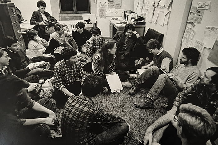 A business meeting in the GayPAC office in Willard Straight Hall. These meetings are held every Thursday to plan discussion topics and future group activities, vote on issues and policies, and are open to the public. Credit: David Ruether, 1984