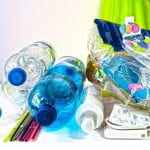 Plastic Waste - a pile of plastic water bottles, straws, pill packs and bags