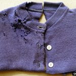 Purple button down sweater with lots of holes