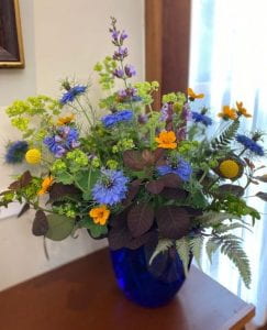 Floral Arrangement with purple and yellow flowers