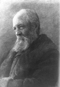 Photo of an engraving of Olmsted in 1893. It is a profile of Omsted sitting wearing a dark jacket. He is an old man, bald on the top of his head with long white bear.