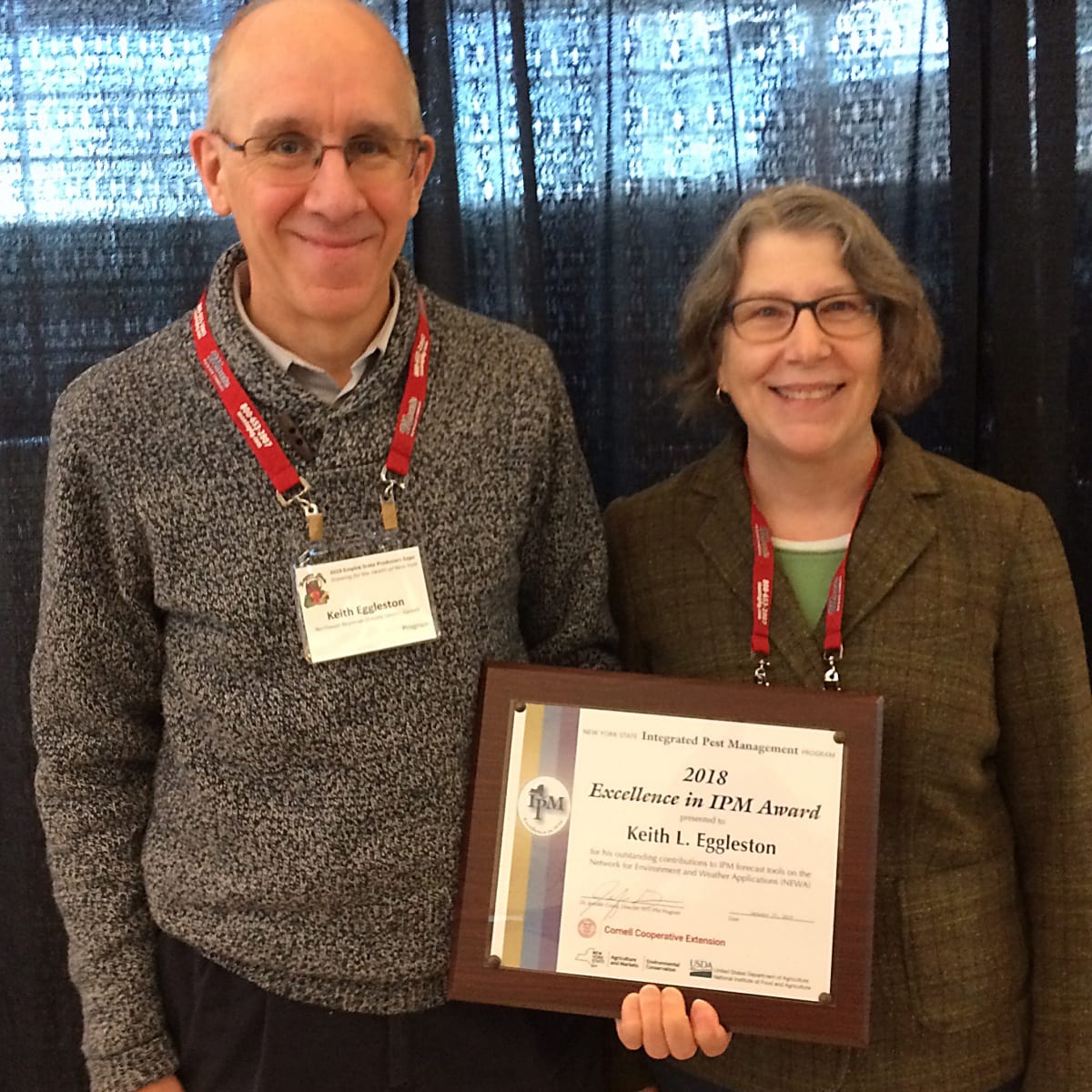 Photo shows Excellence in IPM Award winner Keith L. Eggleston and NYSIPM Fruit IPM Coordinator, Dr. Juliet Carrol
