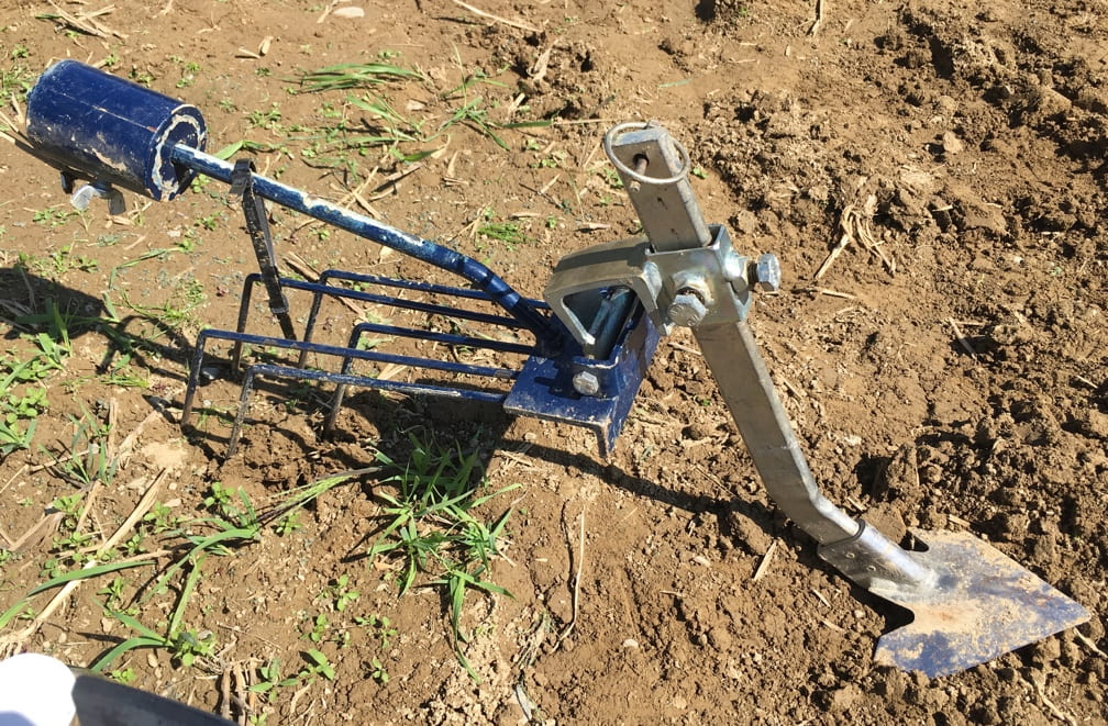 image shows a small attachment suitable for weeding grain fields.