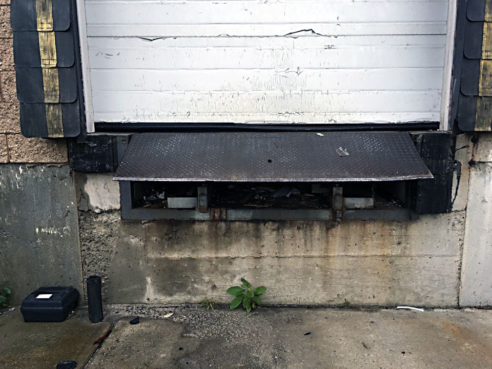 photo shows a loading dock with gaps in the door 