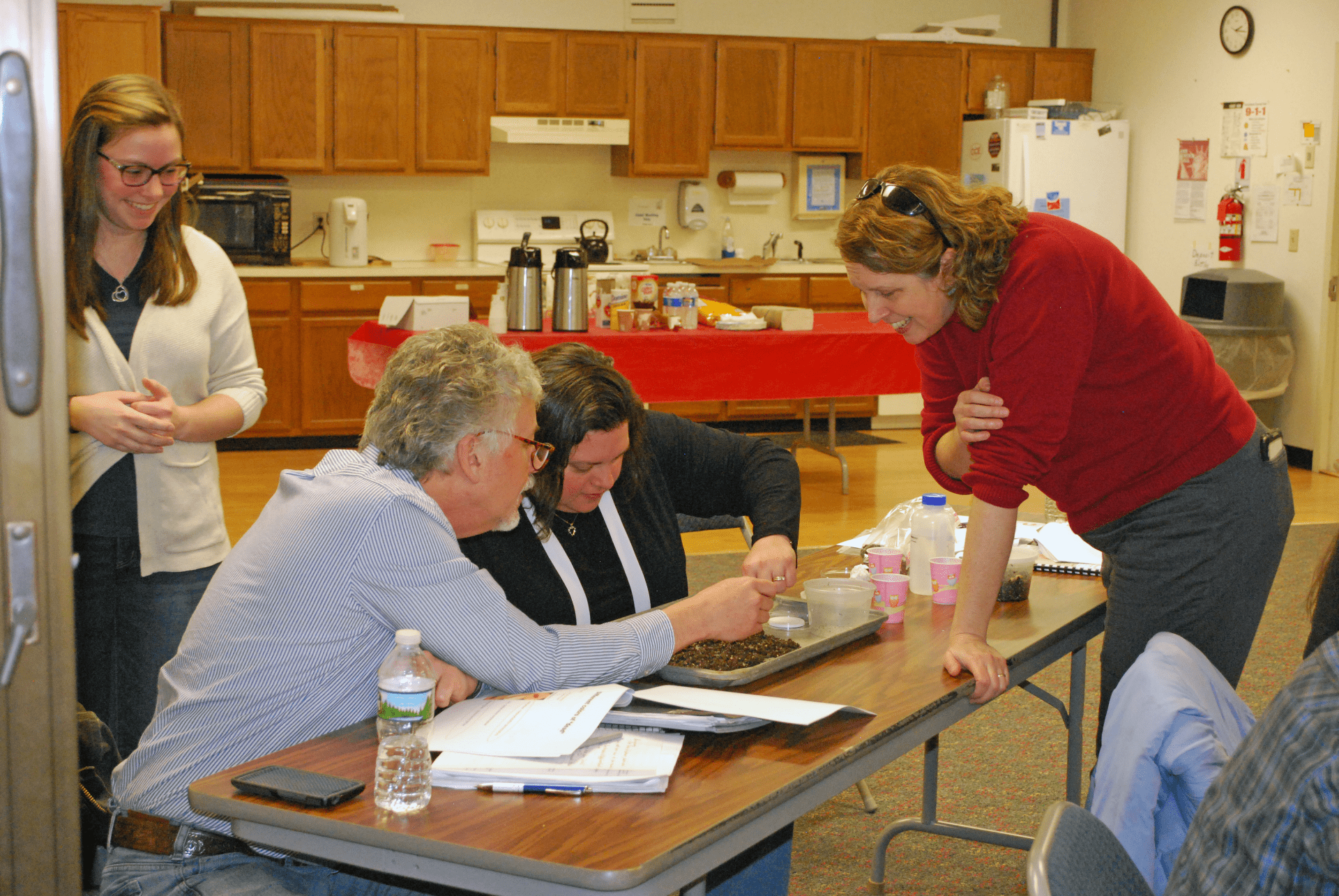 Joellen Lampman and Cornell Cooperative Extension staff and Master Gardeners examine soil and nematodes
