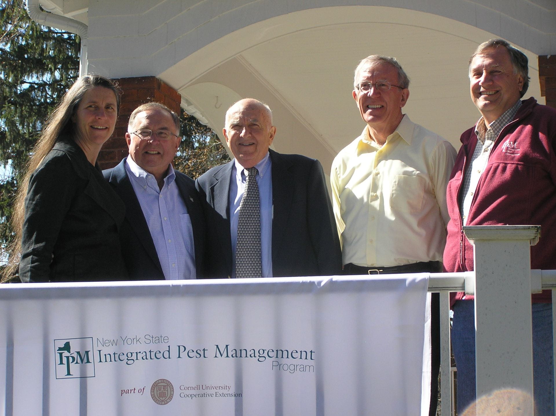 all the IPM directors in one photo on porch of IPM house