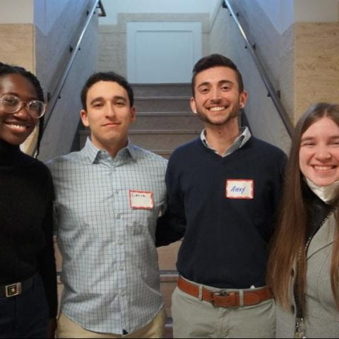 Milcah Abena Andoh, M.P.H.’24, (left) and Avery Sirwatka M.P.H.’24, (middle right) along with teammates Lance Rombro (middle left), a senior in Biology & Society, and Sarah McIlroy, a junior in the School of Industrial and Labor Relations, won the Cornell competition.