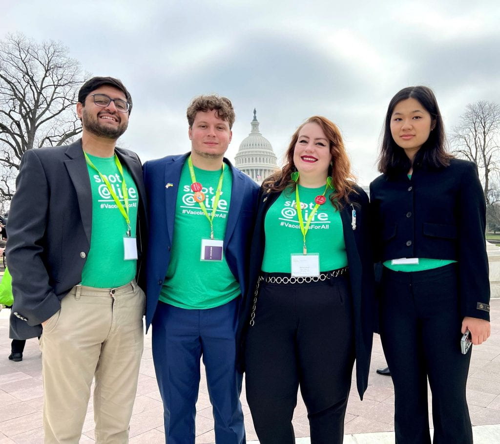 MPH students Parshad Mehta, Aaron Connolly, and Kally Wang, and Student Services Assistant Katie Lesser pose in front of the US Capitol Building