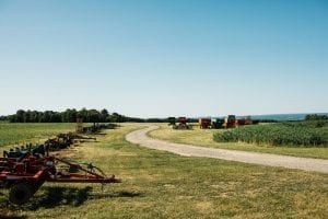 farm equipment lined up in a field