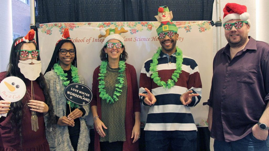 5 people in holiday regalia