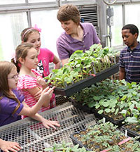 Green house with students