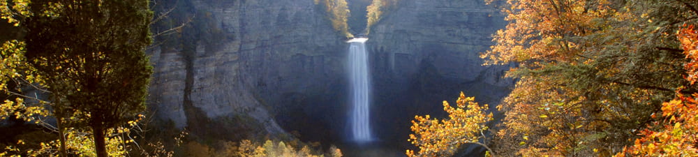 This photo shows the 215 foot high Taughannock Falls, which is the middle of three falls, located in the gorge of the park. It was taken from the Falls Overlook parking area just off Taughannock Park Rd. If you're hiking the North Rim Trail you'll also pass the overlook with conveniently located picnic tables and restrooms.