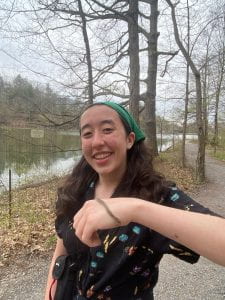 Emily holding an insect