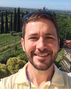 Jason Londo headshot - in front of a beautiful vineyard scene