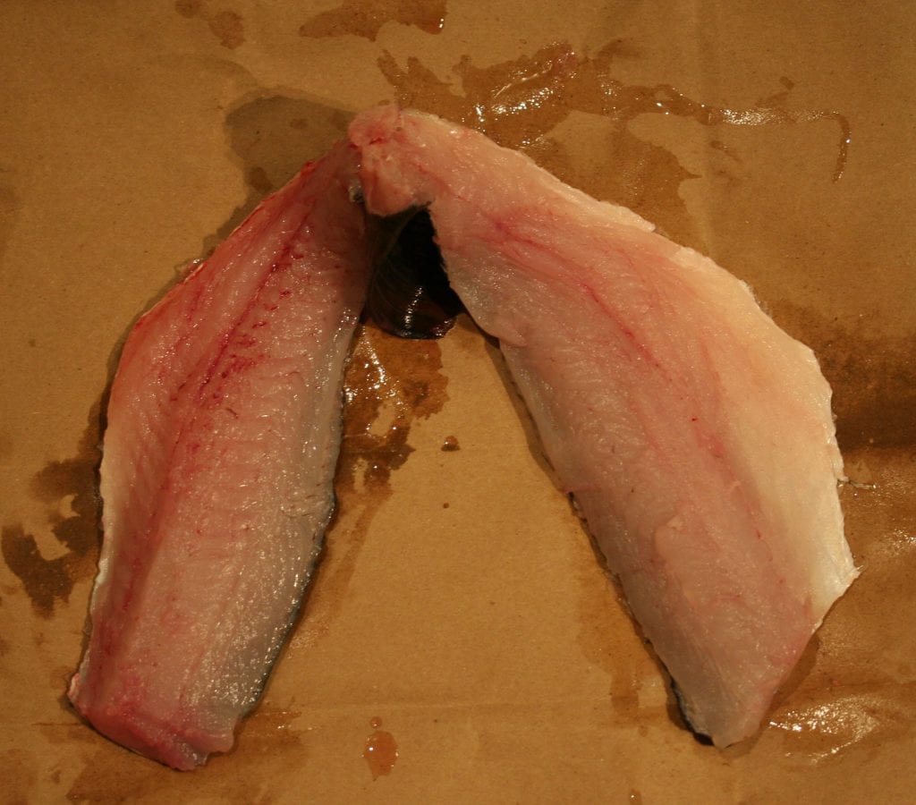 bass fillets skinless attached at tail